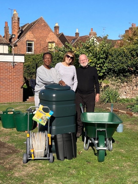 3 members of the group with the gardening equipment